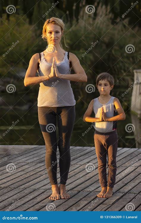 Mother And Son Exercising Yoga Pose Stock Image Image Of Female Peaceful