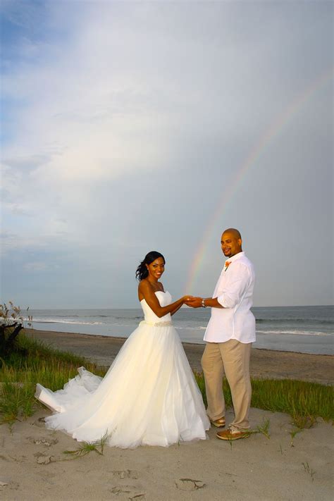 As you walk down tybee's sandy beaches with the ocean breeze in your hair, the soft spray of the ocean mist and your toes in the sand,wedding memories begin to be made with the one you love. Tybee Island Beach Wedding Bride and groom with rainbow ...