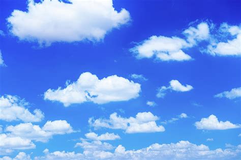 Fluffy White Clouds In A Blue Sky Photograph By Emrah Turudu Fine Art