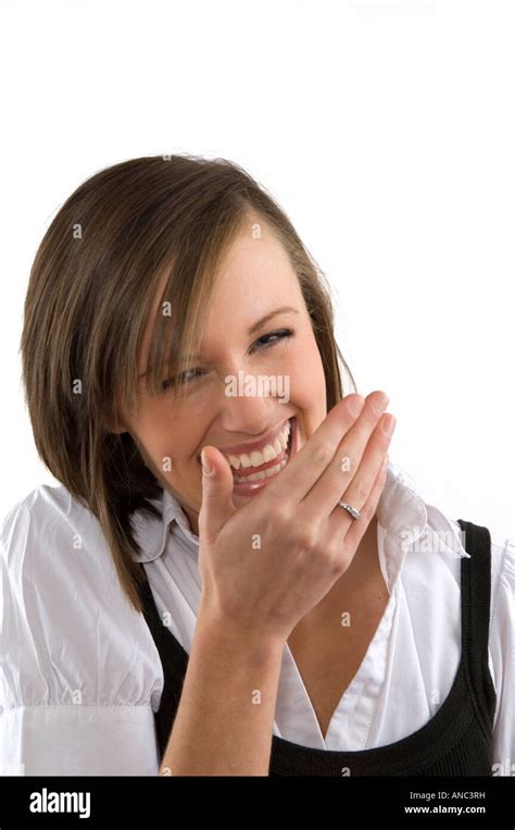 Woman Laughing With Hand In Front Of Her Mouth Stock Photo Alamy