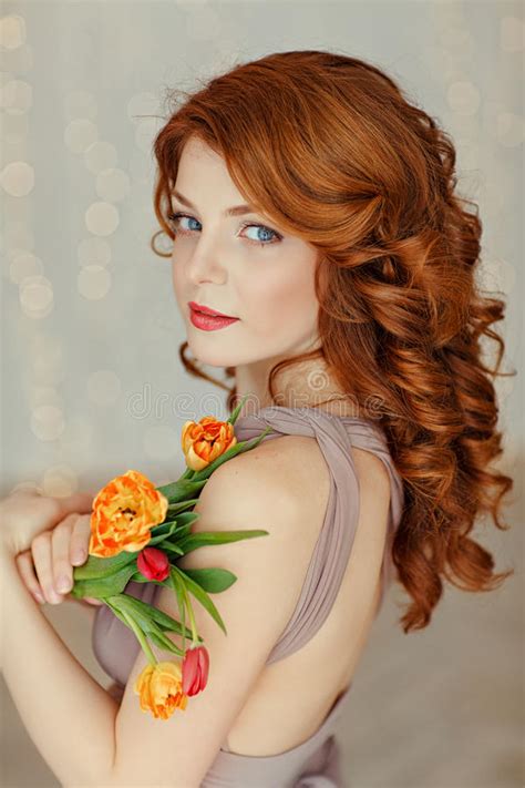 Portrait Of A Beautiful Red Haired Girl With Blue Eyes