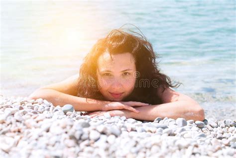 Beautiful Happy Girl Is Sunbathing On The Beach Stock Photo Image Of