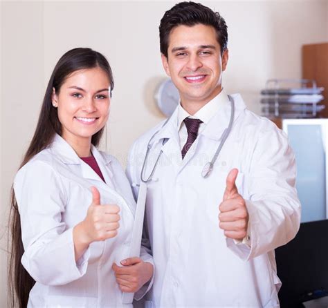 Professional Doctors Smiling In Clinic Stock Image Image Of Caucasian