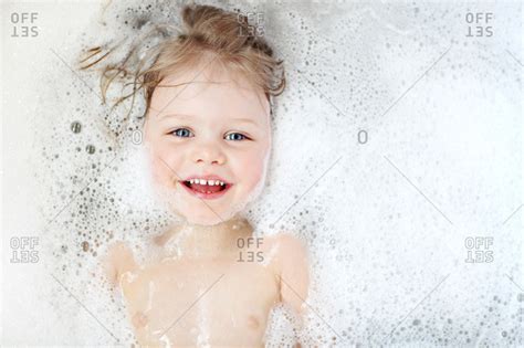 Smiling Girl Having Bubble Bath Stock Photo Dissolve