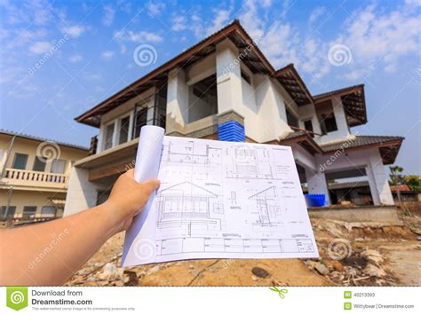 Architecture Drawings In Hand On Big House Building Stock