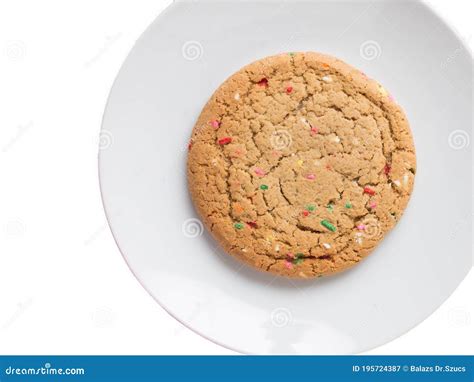 Almond Giant Biscuits With Coloured Sugar Pieces On A White Platter