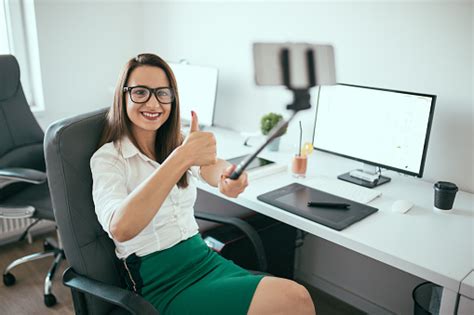 Beautiful Young Lady In Office Stock Photo Download Image Now Desk