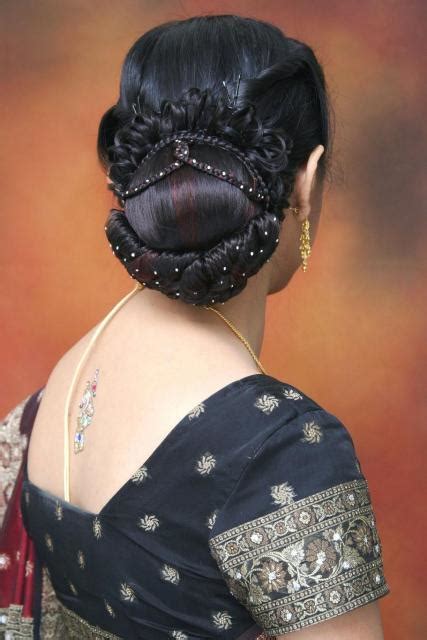 Look at this since quite a while ago meshed wedding hairdo which is curled open hairstyle for brides. South Indian Bridal HairStyles ~ Bridal Wears