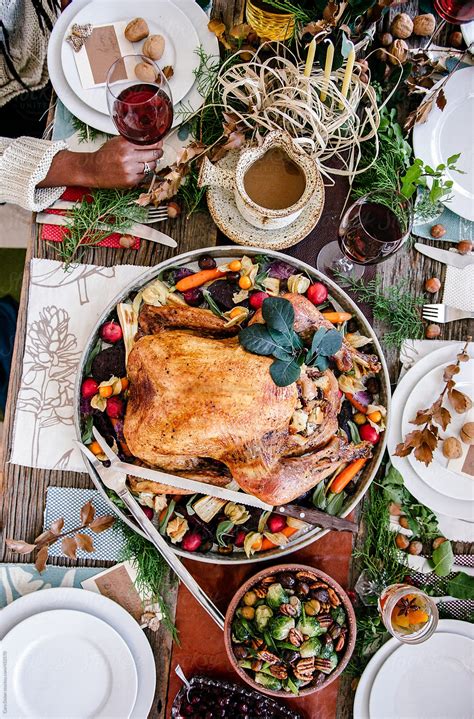 Overhead View Of A Dinner Table Set For Holiday Feast By Cara Dolan
