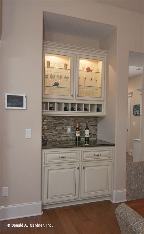 Is your kitchen up for the challenge? A wet bar is conveniently located by the kitchen, and ...