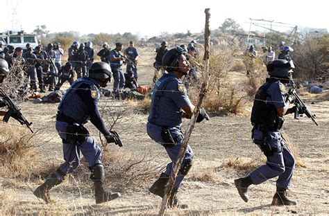 south african police open fire on striking miners in…