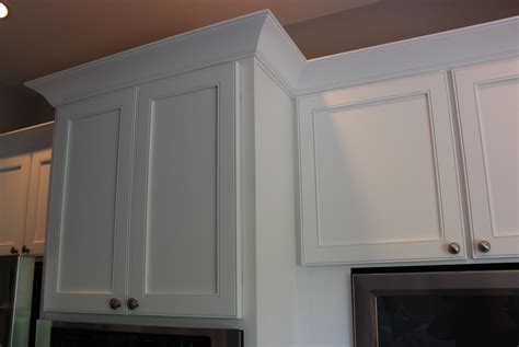 When ceiling heights grew to 9 ft., kitchen it looks great, ties into the kitchen crown molding, and needs little dusting. Architecture Shaker Cabinet Crown Molding Elegant Moulding