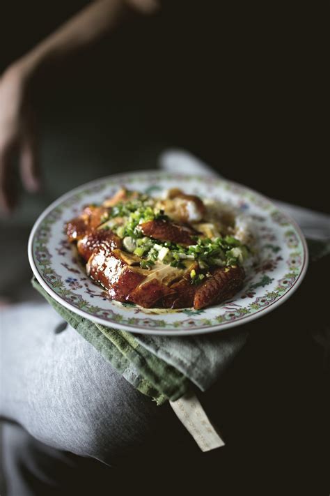 A whole chicken or chicken wings are cooked and soaked with soy sauce. Lady and Pups | SUPPLE SLOW-COOKED SOY SAUCE CHICKEN RICE