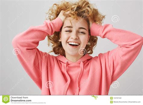 Feeling Carefree And Happy Portrait Of Emotive Young Woman With Curls