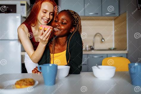 happy lesbian couple preparing breakfast in the kitchen stock image image of affection