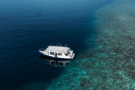 Yacht Moored On Azure Shallow Sea · Free Stock Photo