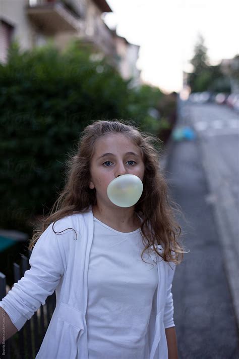 Girl Blowing A Big Bubble Gum Bubble By Stocksy Contributor Beatrix Boros Stocksy