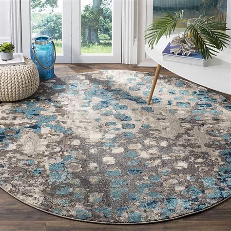 Bring exciting rustic textures into your home with this unique area rug inspired by the rich mineral tones and natural veining of granite. Modern Abstract Grey and Light Blue Round Area Rug | Round ...