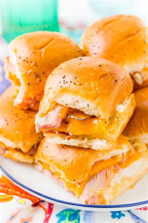 A sweet blend of meaty and chunky ham with generous slices of cheeses sandwiched between perfectly fluffy buns. Easy Ham and Cheese Sliders Recipe | Sugar & Soul