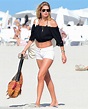 Doutzen Kroes displays model figure in cropped top and tiny shorts in ...