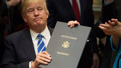 Trump Signs Four Bills To Roll Back Obama Era Regulations