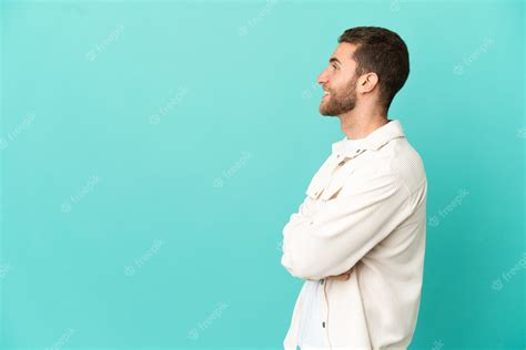 Premium Photo Handsome Blonde Man Over Isolated Blue Background In