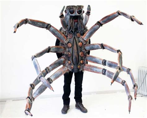 A Realistic Spider Costume Featuring Flicking Tongue Action And A Voice