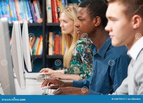 Group Of Students Working At Computers In Classroom Stock Image Image