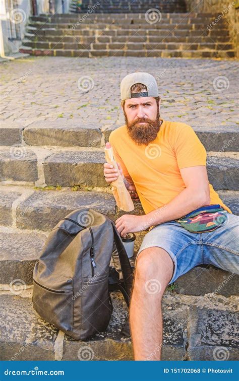 Getting Some Rest And Hiking More Caucasian Hipster Relaxing On Stairs