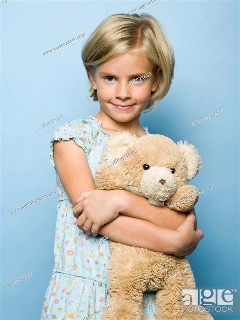 Girl Hugging Teddy Bear Stock Photo Picture And Royalty Free Image