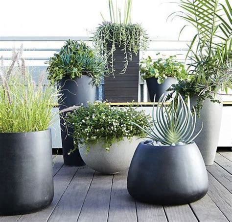 White ceramic indoor planter (7 in. 37 Modern Planters To Make Your Outdoors Stylish - DigsDigs