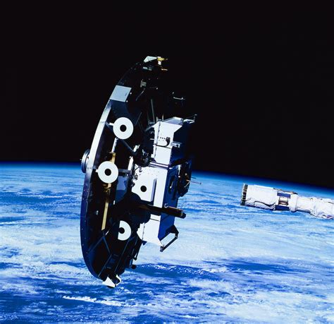 Deployment Of A Satellite In Space By Stockbyte