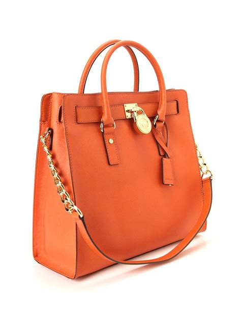 Many consumers would choose michael kors handbags that are yellow, white and silver for a more stylish, modern look. Michael Kors: Designer handbags, clothing, watches, shoes ...