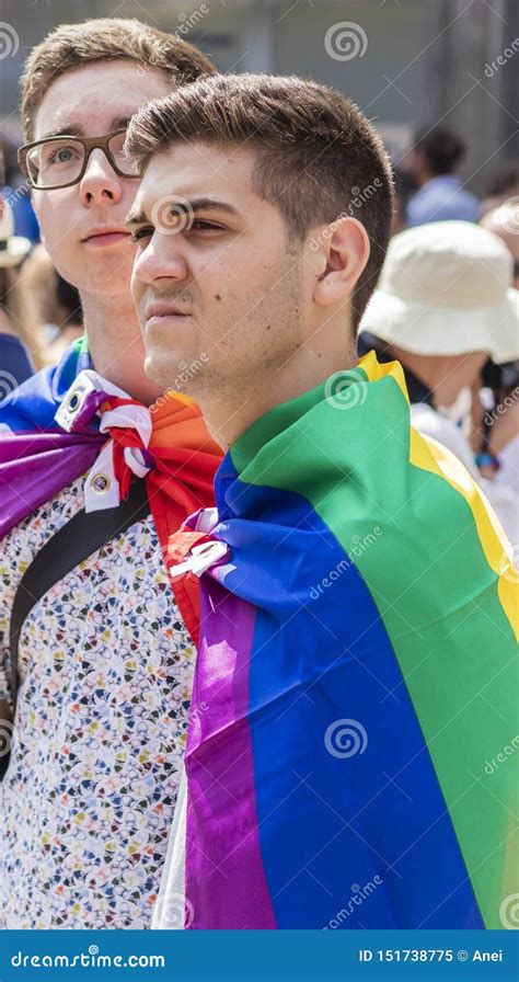2018 Young Gay Man With A Rainbow Coat Attending The Gay Pride Parade Also Known As Christopher