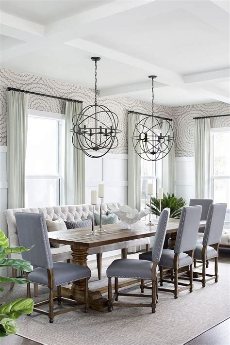 Dining Room With Two Orb Chandeliers Over Dining Table Dining Room With Two Orb Chandelie