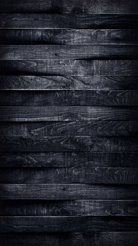 Dark Wood Planks With Some Light Shining On Them