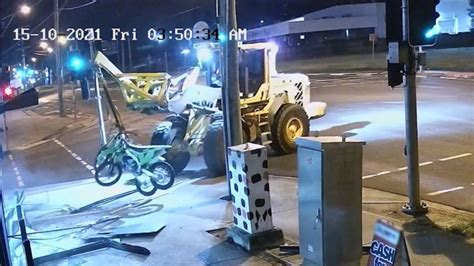 footage captures man s wild excavator joy ride across train tracks as cops give chase the west