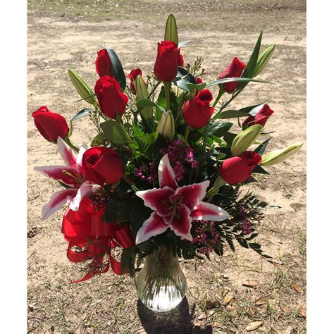 Ultimate Dozen Rose Arrangement With Stargazer Lilies Red Sunshine