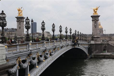 Seine river cruise port highlights. The Alexander III Bridge across river Seine in Paris ...