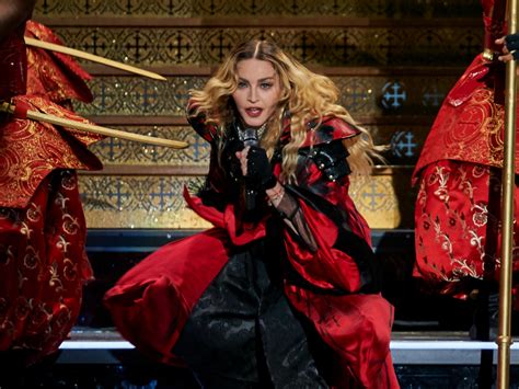 madonna in trouble singer pulls down 17 year old fan s top at melbourne show out magazine