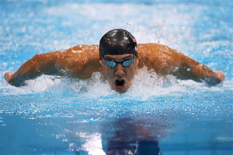 Usa's michael phelps reacts after the men's 100m butterfly final during the swimming event at the rio 2016 olympic games at the olympic aquatics stadium rio de janeiro — a stunner at the rio olympics: Michael Phelps wins silver in the 200m butterfly - London ...