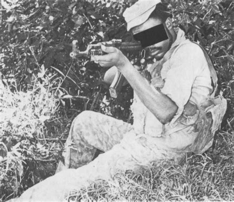 A Member Of The Rhodesian African Rifles Displaying Captured Zipra