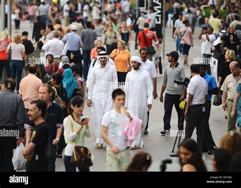 Arab Men In A Crowd Of Tourists Dubai United Arab Emirates Stock