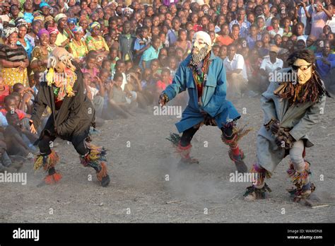 Traditional Nyau Dancers With Face Mask At A Gule Wamkulu Ceremony In