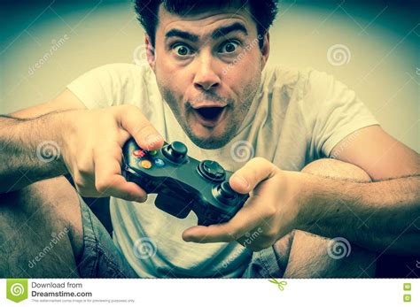 Emotional Young Addicted Man Playing Video Games Stock Photo Image Of