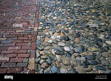 A Cobblestone And Brick Street In Savannah Georgia Along The Historic