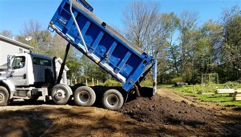 Truck Dropping Off Dirt Fischer Brothers Excavating Foundations