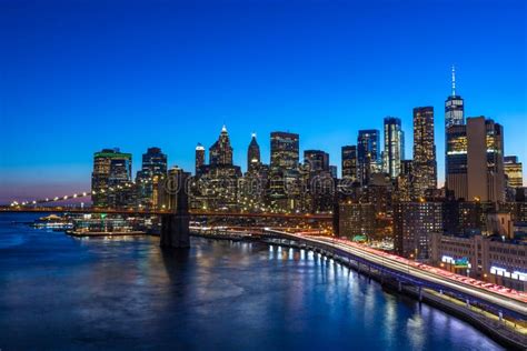 Brooklyn Bridge In Manhattan Downtown With Cityscape At Night New York
