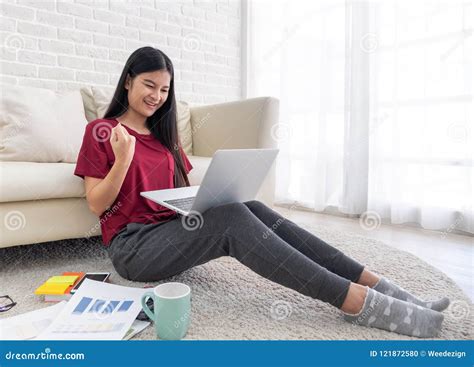 Asian Woman Freelancer Hand Up And Smile For Success Working On Stock