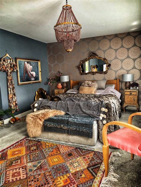 A Bedroom With A Bed Chair And Rugs On The Floor In Front Of A Chandelier